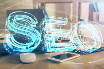 Multi exposure of table with computer and seo drawing hologram. Search optimization concept.