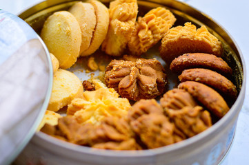 Closeup of Mixed Flavor Cookies in Round Box.