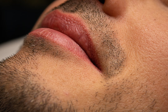 Male NU Lips. Young man closeup lips, male permanent make up, men's bristle.