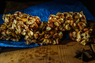  candy from nuts on blue paper on a dark background4