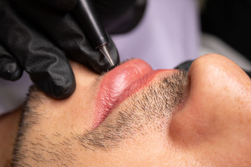 Male NU Lips. Young man closeup lips, male permanent make up, men's bristle. - obrazy, fototapety, plakaty
