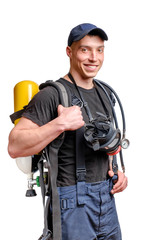Young smiling firefighter with a mask and an air pack on his back in black t-shirt