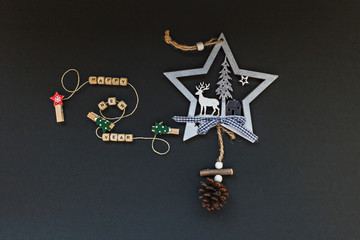Fototapeta na wymiar Christmas decorations and attributes of the new year on a black background. Flatlay.