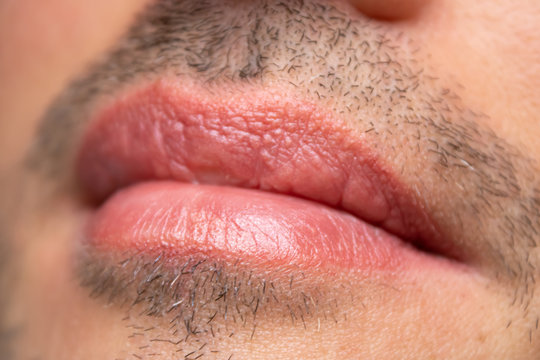 Male NU Lips. Young man closeup lips, male permanent make up, men's bristle.