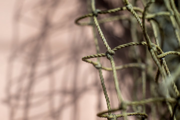mesh string bags close-up with shadows on the wall