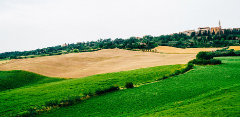 Fototapeta na wymiar Landscape panorama from Tuscany. Panoramic view of a spring day in the Italian rural landscape.