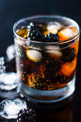 Fruit Drink with Ice Against Black Background