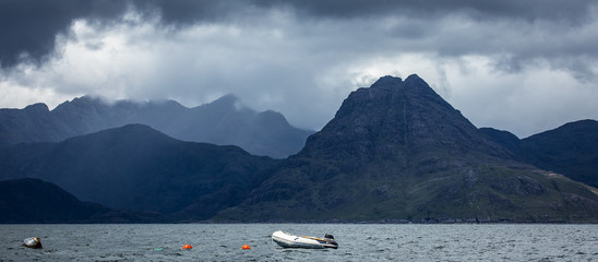 Beautiful scenic landscape of amazing Scotland nature with boat.