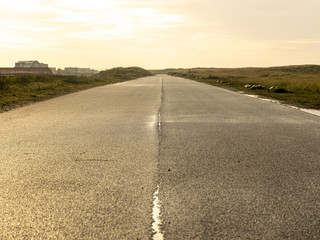 view of wet asphalt road
