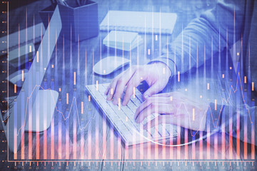 Double exposure of financial graph with man works in office on background. Concept of analysis.