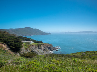 View to the Golden Gate Bridge with fog dust and nature landscape 