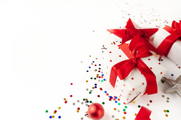 Christmas card with gift box and toys on White background. Top view with place for your congratulations.