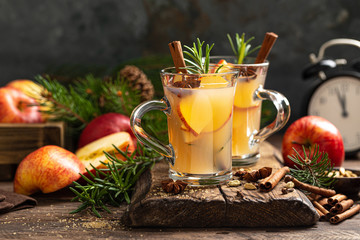Christmas mulled apple cider with cinnamon and anise, traditional winter warming hot drink,...