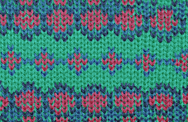 festive decorative knitted background of colored threads for decoration of warm clothes