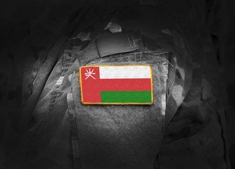 Flag of Oman on military uniform. Army, armed forces, soldiers. Collage.