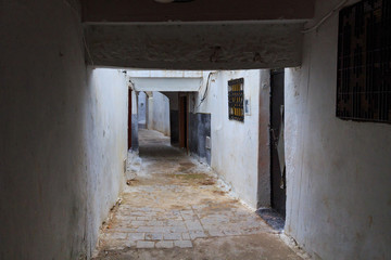 Obraz premium View of the one of the typical old narrow streets of Tetouan (Northern Morocco) in historical center of the city.