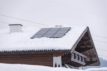 Solar panel, photovoltaic, PV panels on a house roof. Electricity from the sun. House in the mountains. - 304813905