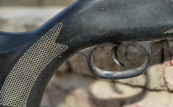 closeup of a riffle barrel and it's aim 