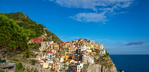 Fototapeta na wymiar Manarola, Italy. Landmark village in Cinque Terre national park in Italy, Liguria. UNESCO world heritage site. Manarola is famous and popular travel destination.