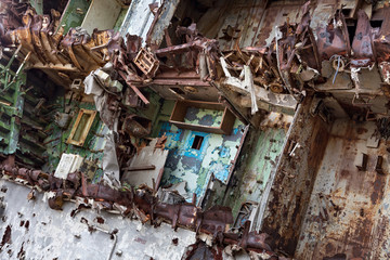 Internal parts of decommissioned marine ship that was cut and left on the shore.