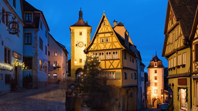 Day to night transition long exposure hyper lapse of Rothenburg ob der Tauber old town Das Plonlein at Christmas, Bavaria, Germany.