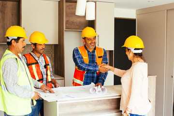 Construction team shaking hands