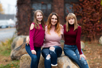 Teenager girls, Daughters and Mother smiling and hug together. Adorable Affection Casual Life Concept