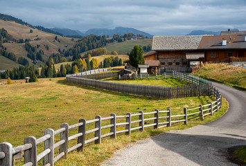 Fototapeta na wymiar Wooden chalet at the famous Alpe di Siusi valley on the Dolomites, South Tyrol in Italy