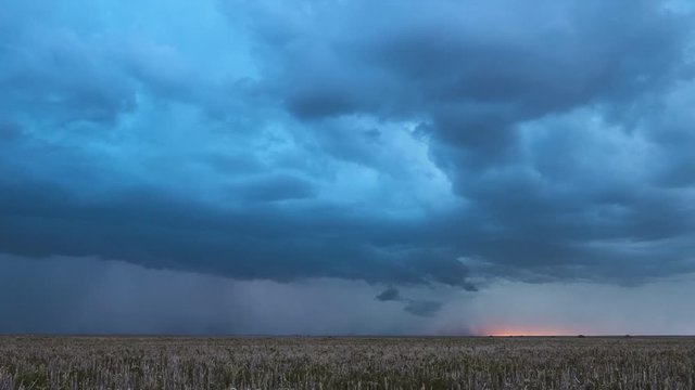 Supercell lightning storm moving over the landscape during the monsoon season.