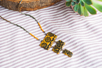 Boho style necklace in macro. Handmade jewelry background.