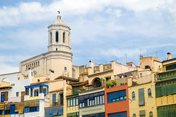 Fototapeta na wymiar Cathedral of Saint Mary of Girona over city houses roofs, Catalonia, Spain.