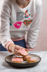 Girl grabbing a cranberry cookie
