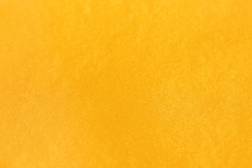 Closeup view of yellow slime as background. Antistress toy