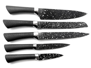Composition of black knives isolated on white background. Composition of the chef knife, bread knife, carving knife, utility knife. Professional Set. Sharp blade in white dots.