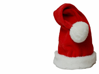 Obraz na płótnie Canvas A bright red christmas elf hat with white pompom and background