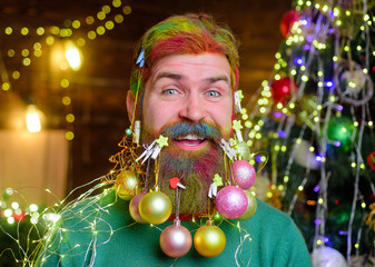 Christmas decoration. Christmas holidays. Cheerful santa man with decorated beard. New year party. Christmas beard decorations. Winter holiday. Decorated beard. Happy bearded man with decorated beard.