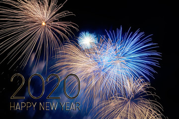 New year 2020 greeting card with gold letters and fireworks