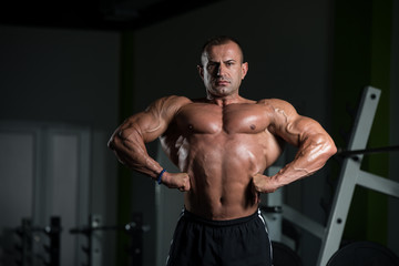 Obraz na płótnie Canvas Mature Bodybuilder Standing In The Gym