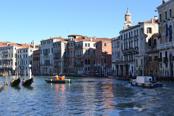 Venice. Grand canal with boats and gondolas. View of the old buildings.