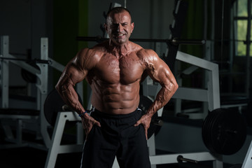 Fototapeta na wymiar Portrait Of A Fitness Muscular Mature Man