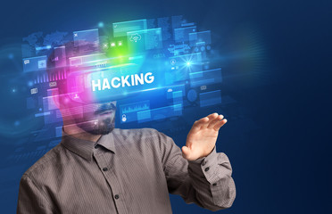 Businessman looking through Virtual Reality glasses with HACKING inscription, innovative security concept