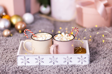 Christmas concept, hot coffee or cocoa candy canes and marshmallows