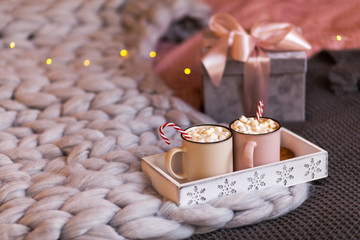 Christmas concept, hot coffee or cocoa candy canes and marshmallows