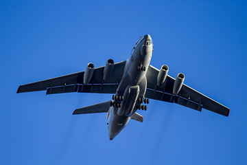 Big plane flies in the sky close up