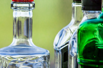 The necks of glass bottles close-up