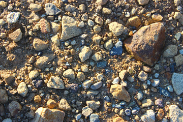 Large and small stones on dry land