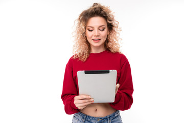 beautiful young girl with a tablet on a white isolated background