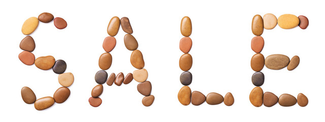 Word of sale laid out of stones, isolated on a white background. Seasonal Sale