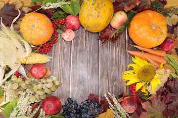 Thanksgiving, autumn background with seasonal autumn nature berries, pumpkins, apples and flowers on a wooden background, copy space, happy thanksgiving concept,