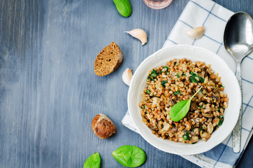 spinach, mushrooms buckwheat with spinach leaves